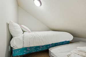 Loft with additional sleeping area above second bedroom