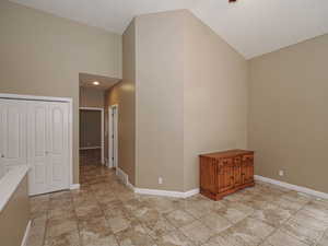 Additional living space featuring vaulted ceiling