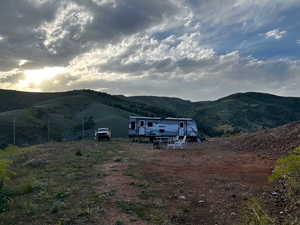 View of mountain backdrop with rural landscape