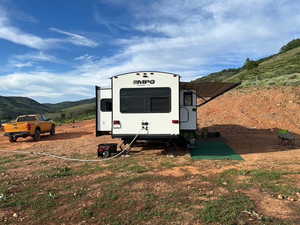 View of outbuilding with a mountain view