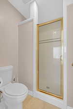 Full bathroom featuring tile patterned floors and a shower stall