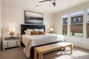 Carpeted bedroom featuring recessed lighting and ceiling fan