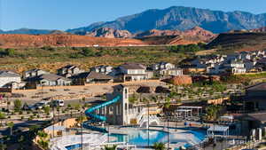 View of mountain backdrop featuring nearby suburban area