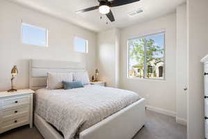 Bedroom featuring carpet and ceiling fan