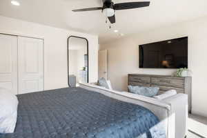 Carpeted bedroom with recessed lighting, a closet, and ceiling fan