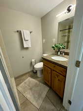 Full bath with vanity and a shower