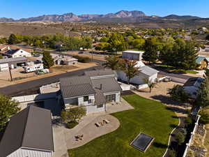 Aerial perspective of suburban area with a mountain backdrop