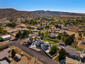 Aerial perspective of suburban area with a mountainous background