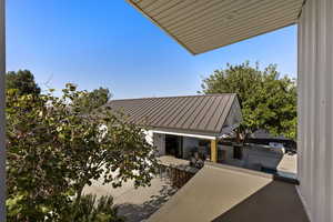 View of patio featuring exterior kitchen