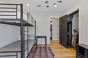 Bedroom featuring light wood-type flooring and recessed lighting