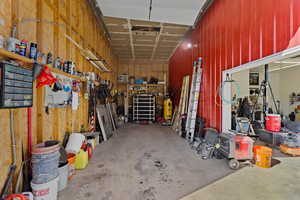Garage featuring wood walls