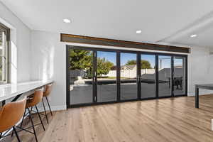 Living area featuring recessed lighting, plenty of natural light, and light wood finished floors