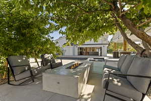 View of patio / terrace with an outdoor living space with a fire pit