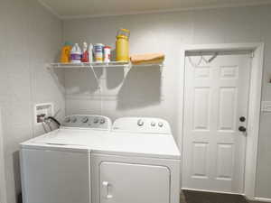 STAGED Laundry room featuring independent washer and dryer