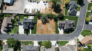 Aerial overview of property's location featuring nearby suburban area