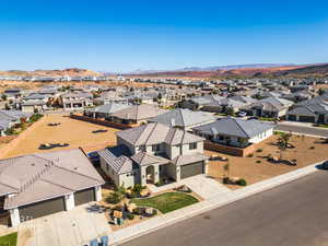 Aerial perspective of suburban area featuring a mountainous background