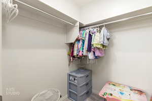 Walk in closet featuring carpet floors