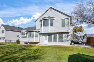 Rear view of house with patio area & RV parking