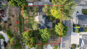 Aerial view of property and surrounding area featuring property boundaries highlighted