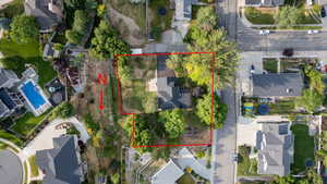 Aerial view of residential area with property parcel outlined