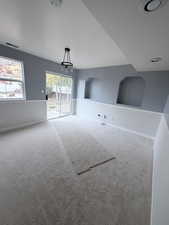 Unfurnished dining area with carpet flooring
