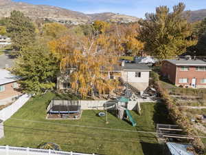 Aerial perspective of suburban area featuring a mountain backdrop