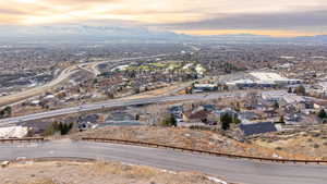 Aerial overview of property's location featuring a mountain backdrop and nearby suburban area