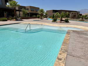 Beach pool featuring a patio area and a mountain view