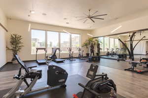 Workout area featuring a textured ceiling and a ceiling fan