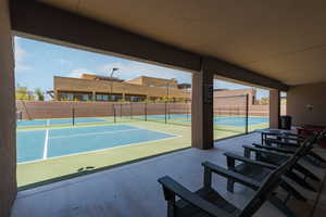 View of pickleball courts with a patio area