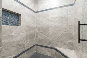 Bathroom with tiled shower