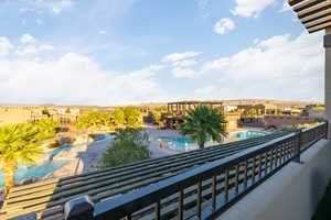 Balcony featuring view of pool
