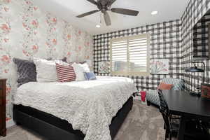 Bedroom #4 with wallpapered walls, light carpet, a ceiling fan, and recessed lighting