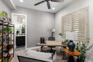 Office space with healthy amount of natural light, light colored carpet, recessed lighting, wallpapered walls, and a ceiling fan