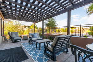 View of patio featuring a pergola and an outdoor hangout area