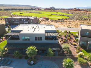 Aerial view of a local golf course and a mountainous background