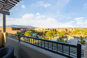 Balcony featuring a mountain view and a residential view