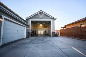 Garage with concrete driveway