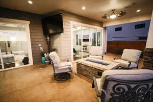 View of patio featuring an outdoor fire pit