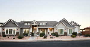 Craftsman-style home with stone siding and a porch