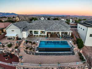 Rear view of property with a patio area, a fenced backyard, and a residential view
