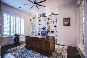 Office with dark wood-type flooring, a ceiling fan, and recessed lighting