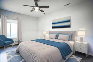 Bedroom with dark wood-style flooring and a ceiling fan