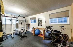 Workout room with a textured ceiling