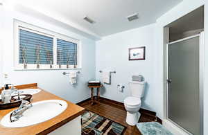 Full bathroom with double vanity and a stall shower