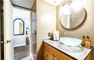 Bathroom featuring vanity and baseboards