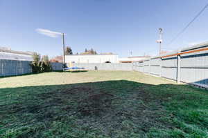 Fenced backyard with a trampoline