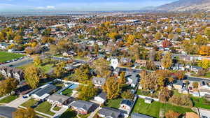 Aerial view of property's location featuring nearby suburban area