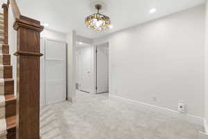 Unfurnished bedroom featuring carpet, recessed lighting, and a closet