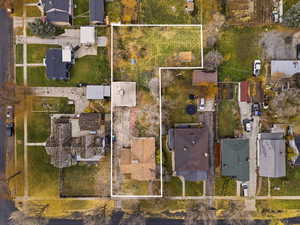 Aerial perspective of suburban area featuring property parcel outlined